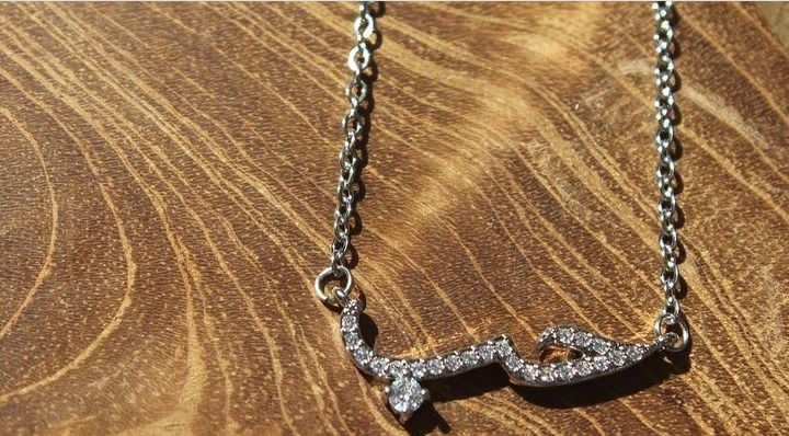 SILVER NECKLACE WITH THE WORD LOVE