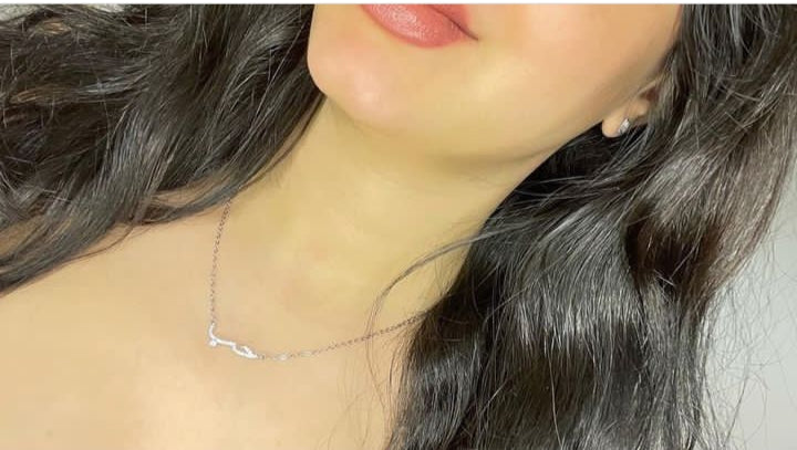 SILVER NECKLACE WITH THE WORD LOVE